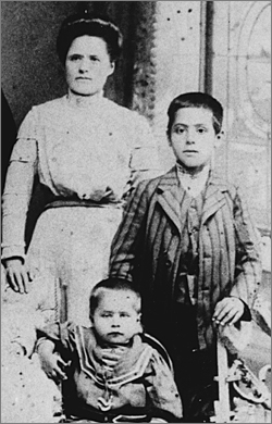 Aged 11 with his mother and brother